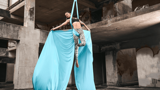 woman on blue aerial silks 